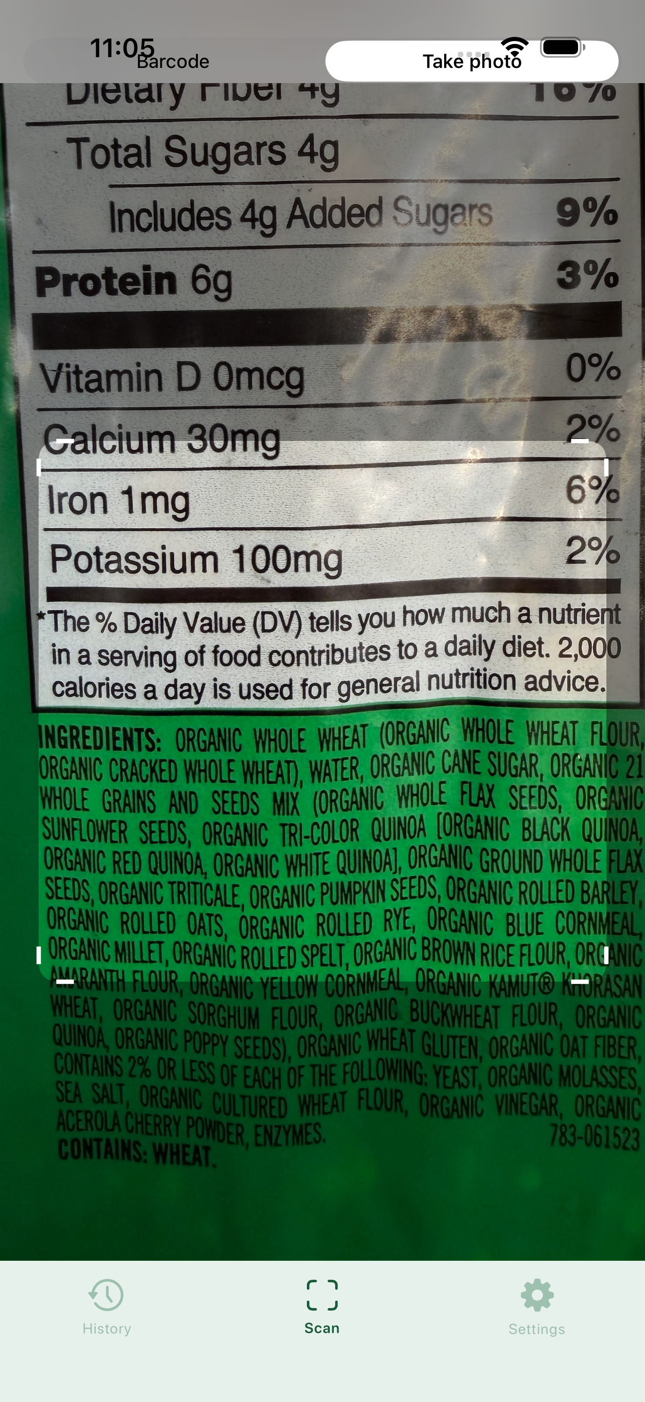 Myredient camera screen with a Barcode / Take photo toggle, framed over a nutrition facts and ingredients label ready to capture.